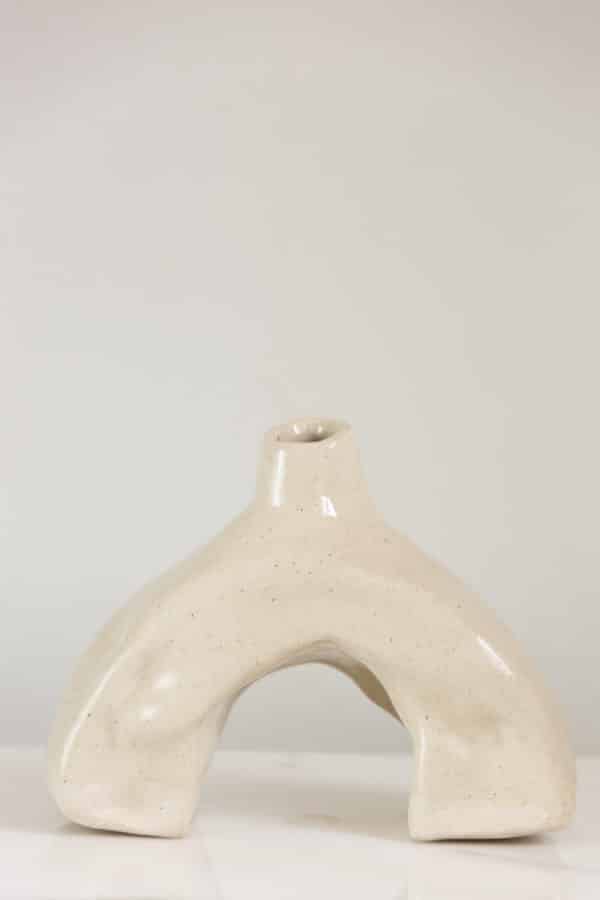 Small hand-built beige ceramic vase this is uniquely curved