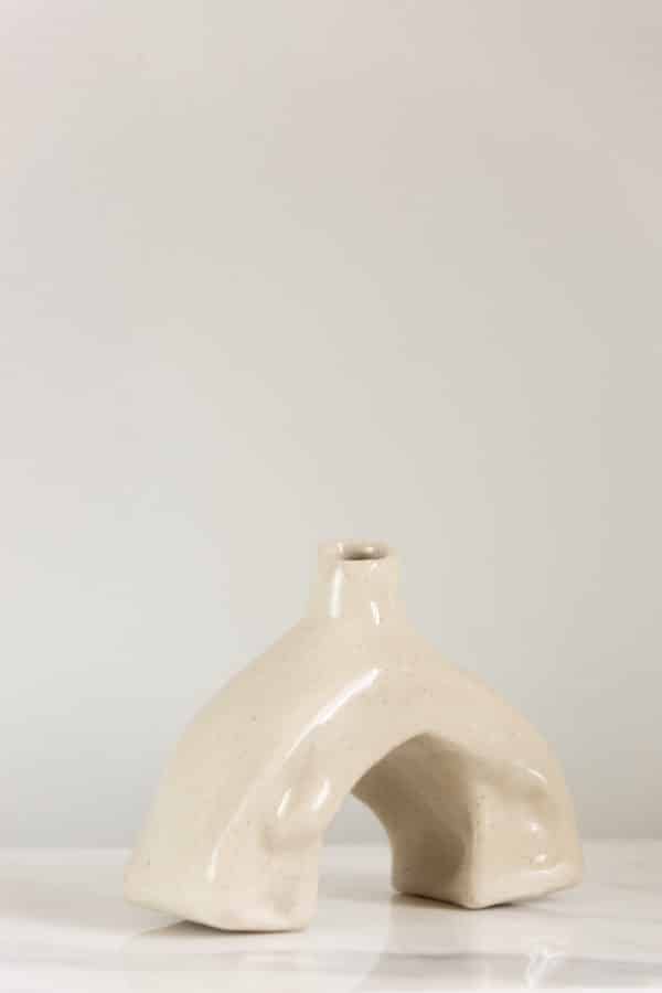 Small hand-built beige ceramic vase this is uniquely curved