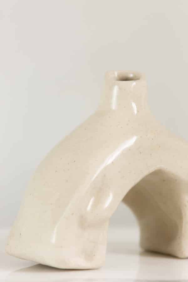 Small hand-built beige ceramic vase this is uniquely curved and a detail image