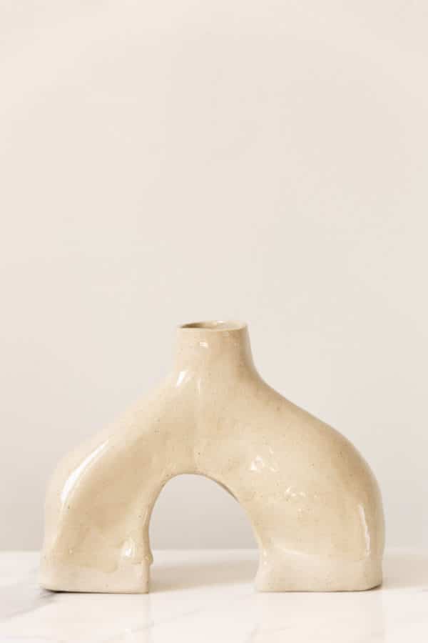 Large hand-built beige ceramic vase this is uniquely curved