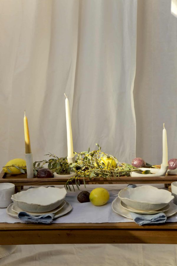Springtime Tablescape with various Alliyah and Things products (Beewax taper candles, blue linen napkins, Stone with dinnerware set, White ceramic cups, stone double candle holder)