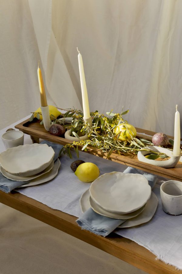 Springtime Tablescape with various Alliyah and Things products (Beewax taper candles, blue linen napkins, Stone with dinnerware set, White ceramic cups, stone double candle holder)