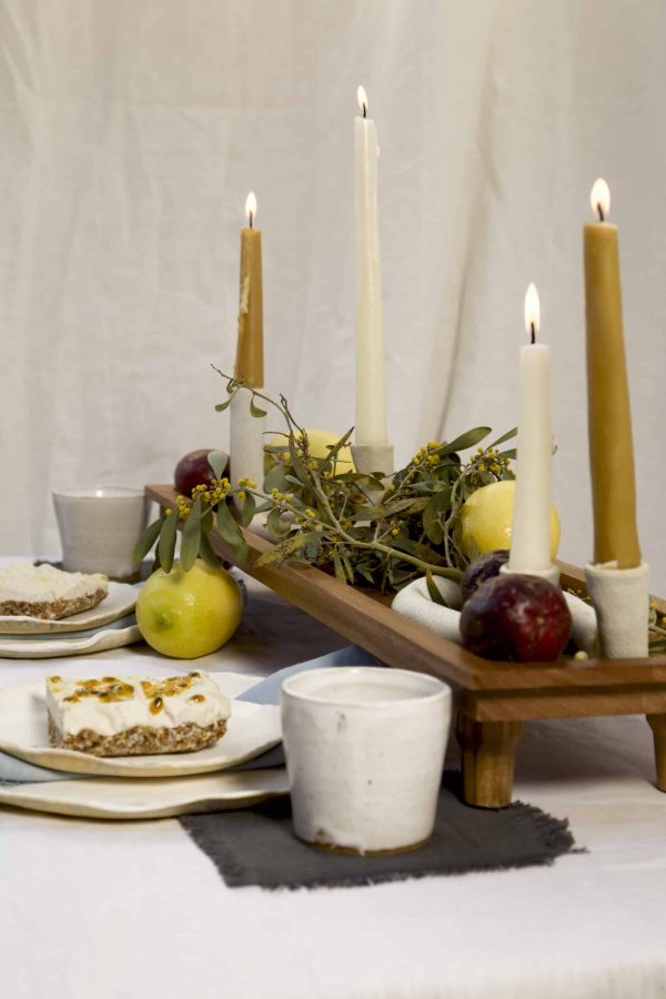 Springtime Tablescape with various Alliyah and Things products (Beewax taper candles, blue linen napkins, linen cocktail napkins, Stone with dinnerware set, White ceramic cups, stone double candle holder)